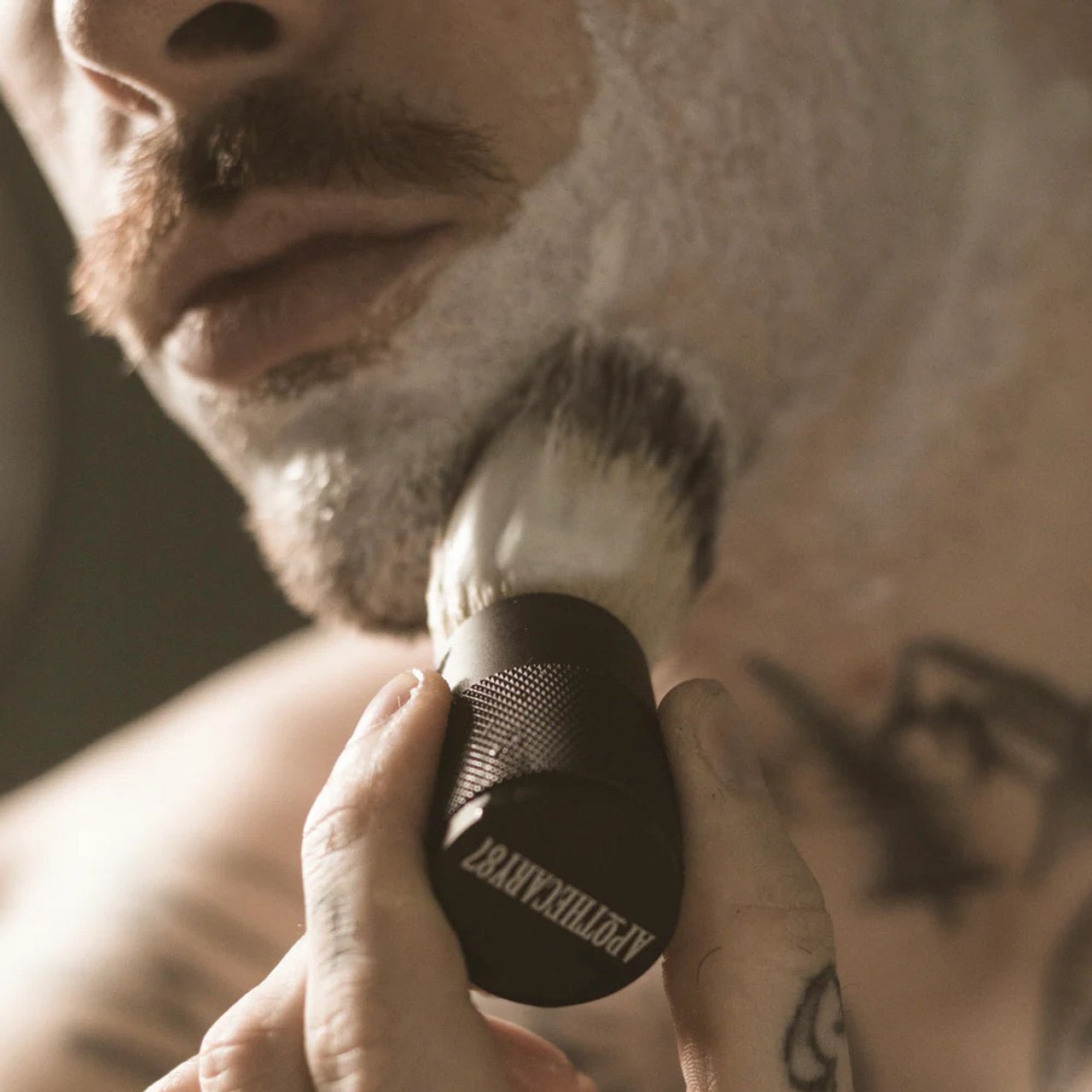 Apothecary 87 Shave Cream in use with shaving brush 