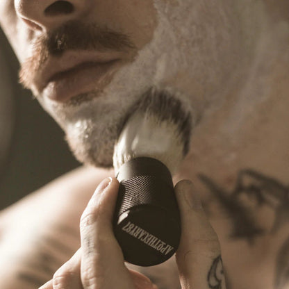 Apothecary 87 Shave Cream in use with shaving brush 