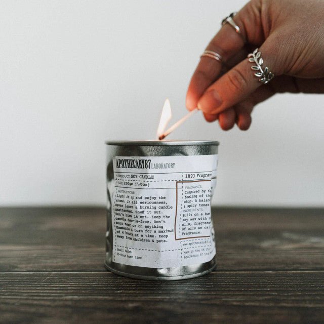 Apothecary 87 Soy Candle A Hoochinoo Fragrance being lit 